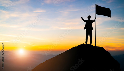 Silhouette businessman atop mountain holds blank flag  symbolizing success  leadership  and opportunity in bright sunlight
