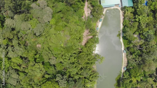 Stunning aerial view of the lush greenery and water body of Kampong Orang Asli photo