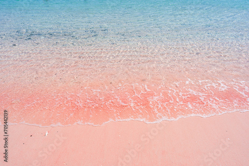Tropical pink sandy beach with clear turquoise water at Komodo islands in Indonesia