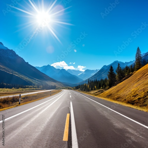 Scenic view of an empty asphalt road through a mountain valley