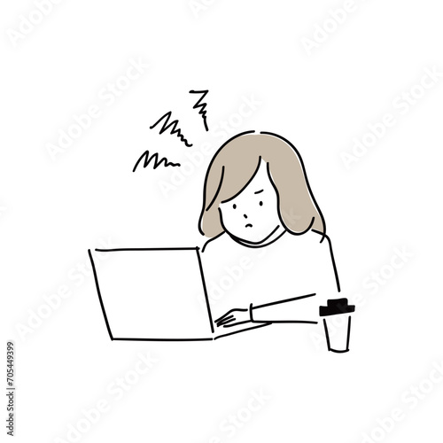 パソコン作業に集中して画面を凝視する若い女性