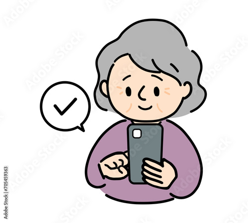 スマホをチェックするシニア女性