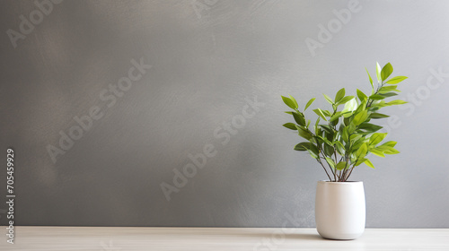 Artificial plant in a vase on a table. Wall with copy space.