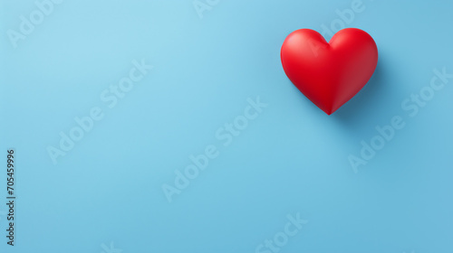 Red heart isolated on a blue background.
