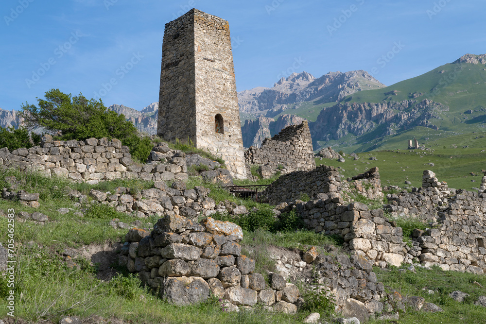 Ancient defensive tower in the North Caucasus mountains on a sunny June morning. Tsmiti, North Ossetia-Alania, Russian Federation