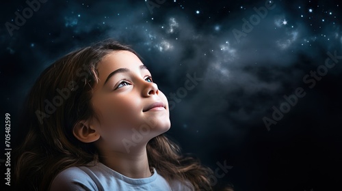 Young girl dreaming of flying to space. 