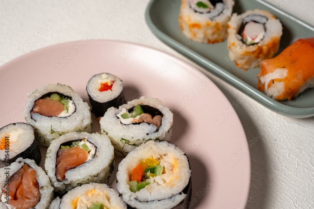 sushi on a pink plate