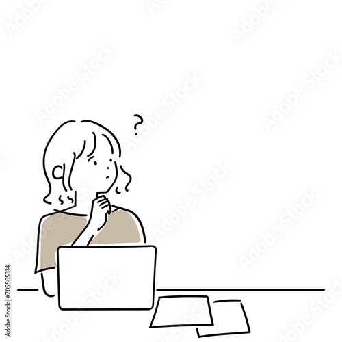 パソコンでの作業中に疑問に思うことが出てきた若い女性