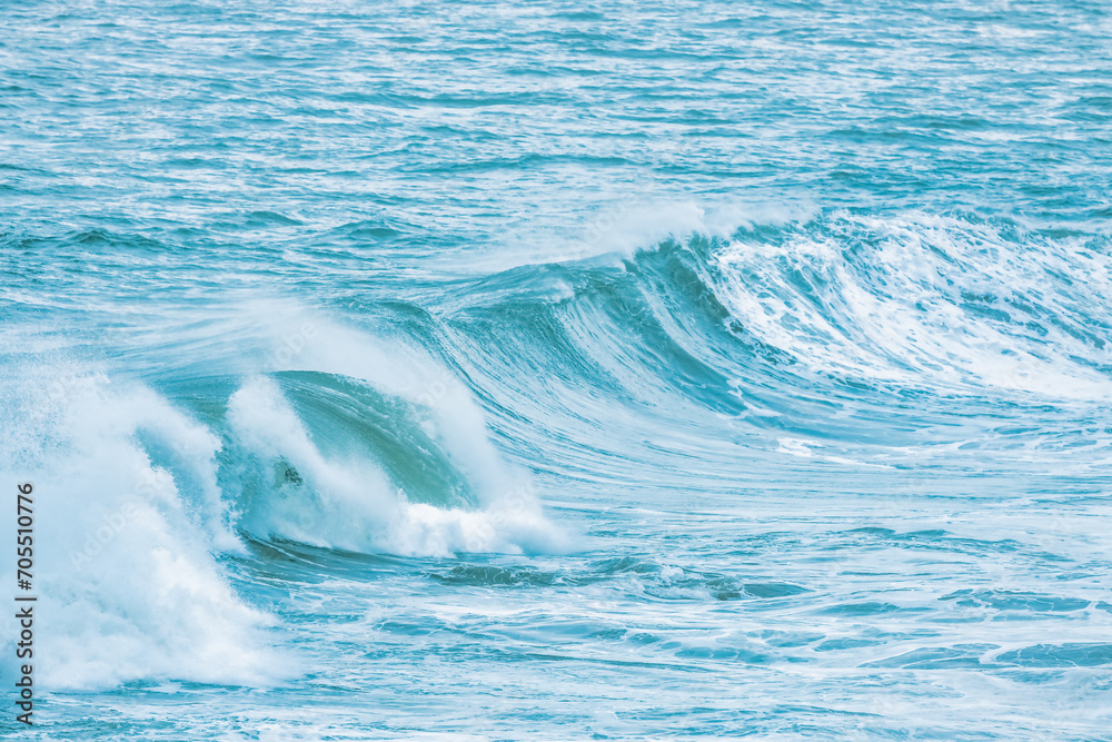 Wave splashing close-up. Crystal clear sea water, in the ocean in San Francisco Bay, blue water, pastel colors. Wave splashing close-up. Crystal clear sea water, in the ocean in San Francisco Bay, blue water, pastel colors.