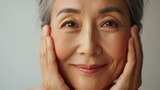 Portrait of a senior Asian woman, aging skincare complexion concept