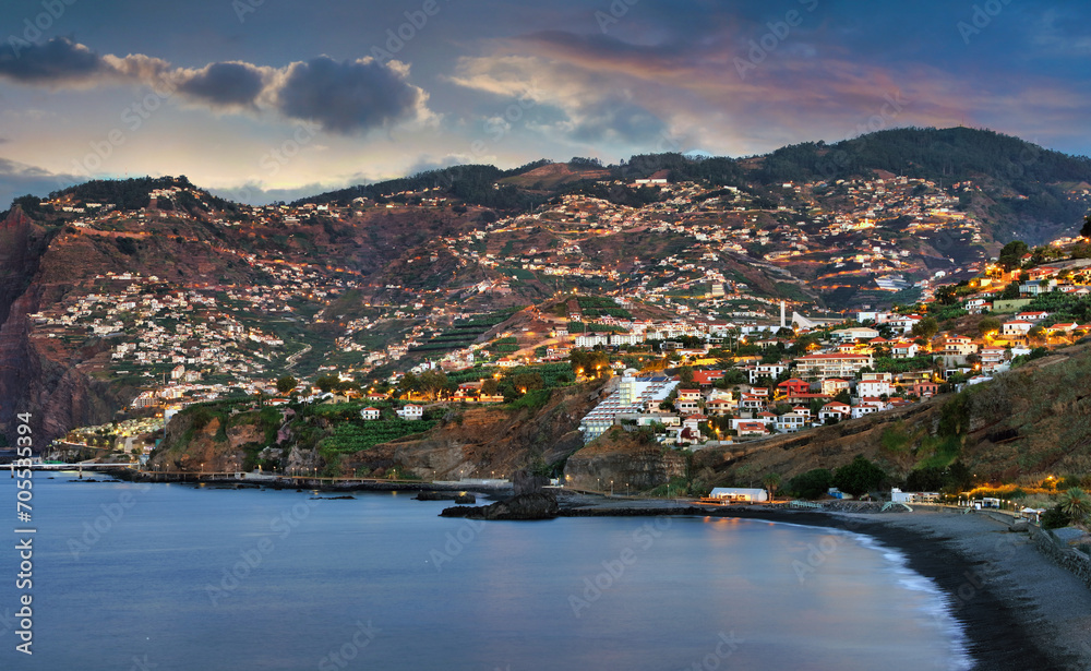 Funchal city at night  in Madeira near black Formosa beach, Portugal