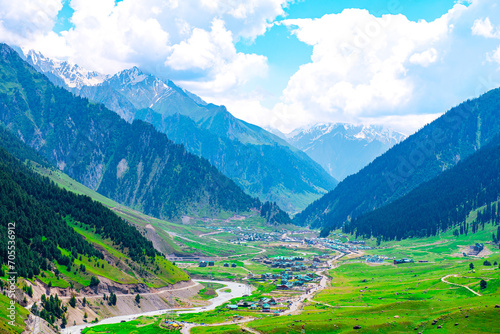 Landscape in the mountains. Panoramic view from the top of Sonmarg, Kashmir valley in the Himalayan region.  meadows, alpine trees, wildflowers and snow on mountain in india. Concept travel nature. photo