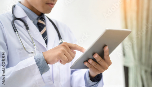 doctor touching screen on tha tablet