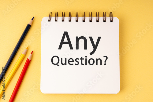 Wallpaper Mural Notepad with text Any Question? on yellow background Torontodigital.ca