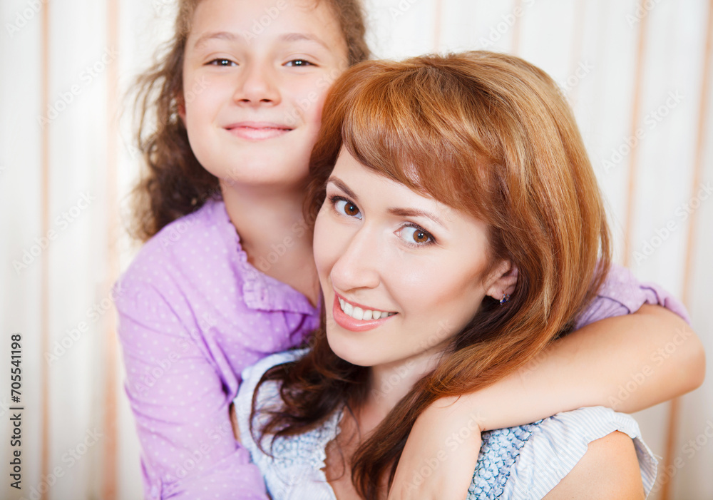 Portrait of happy mother and her little daughter Portrait of happy mother and her little daughter