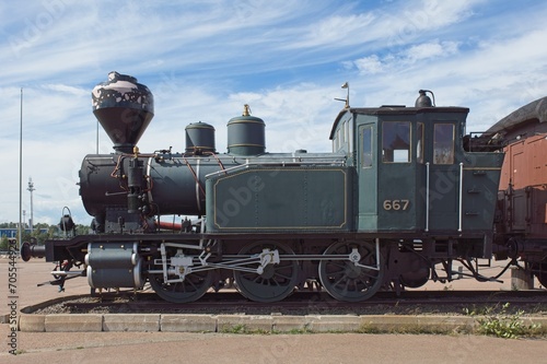 Side view of an old steam locomotive.