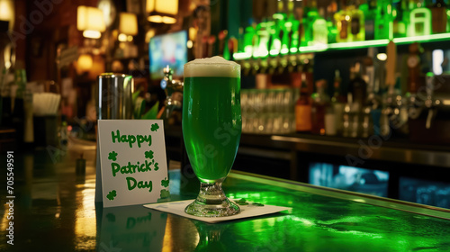 Happy St. Patrick's Day inscription on a piece of paper next to a glass of green beer in a bar, Irish national holiday, traditional drink, note, restaurant, Ireland photo
