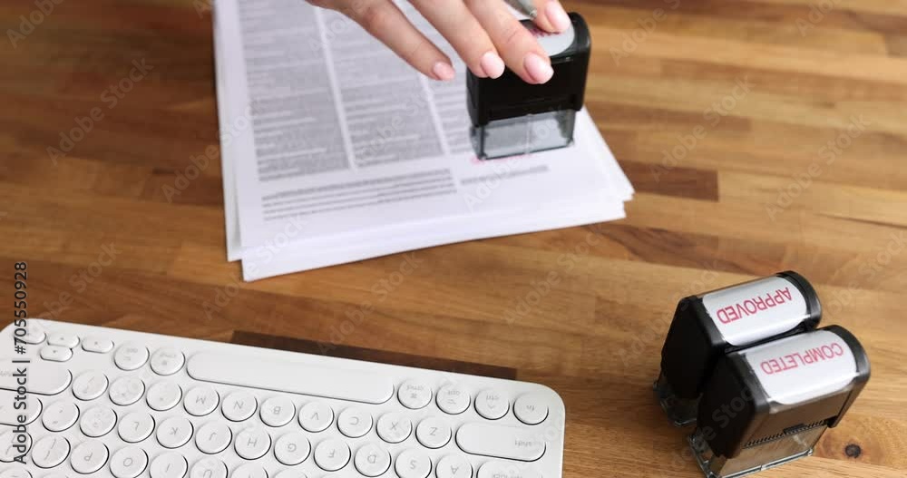 Closeup hand stamping canceled on document. Boss seo bank employee denial of loan or mortgage