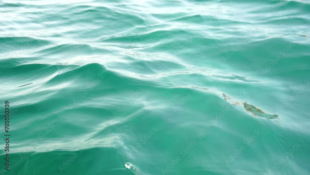 Sea water surface. Camera flies over the calm azure sea. Nobody. Holiday recreation concept. Abstract nautical summer ocean nature. Weather and climate change. Slow motion. Close up Sea water surface. Camera flies over the calm azure sea. Nobody. Holiday recreation concept. Abstract nautical summer ocean nature. Weather and climate change. Slow motion. Close up
