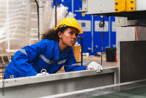 African mechanical worker, maintenance check in factory warehouse, Professional black women engineer, workshop for system operators, engineering women training. Industrial business