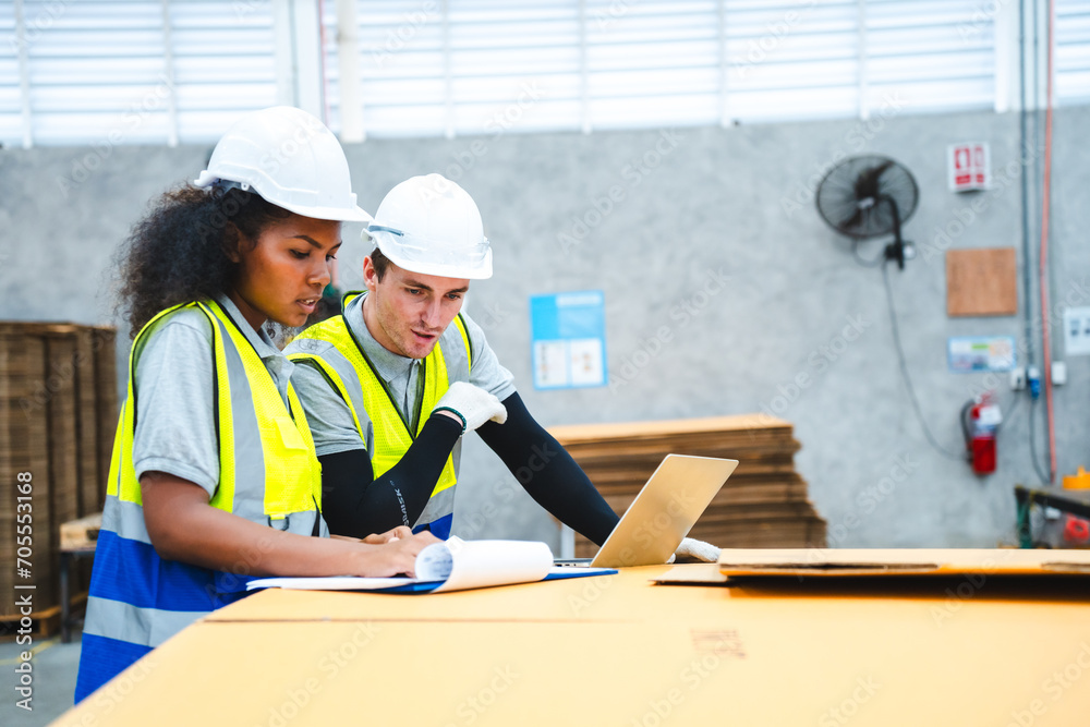 Female engineer using laptop computer for safety control checks or manufacturing maintenance work in factory building or construction site. woman engineer inspector working in industry product line Female engineer using laptop computer for safety control checks or manufacturing maintenance work in factory building or construction site. woman engineer inspector working in industry product line