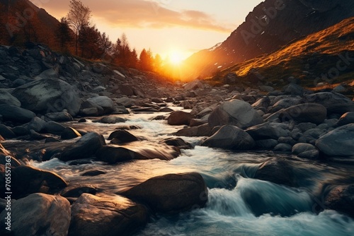 sunset over the mountains and water flow on rocks