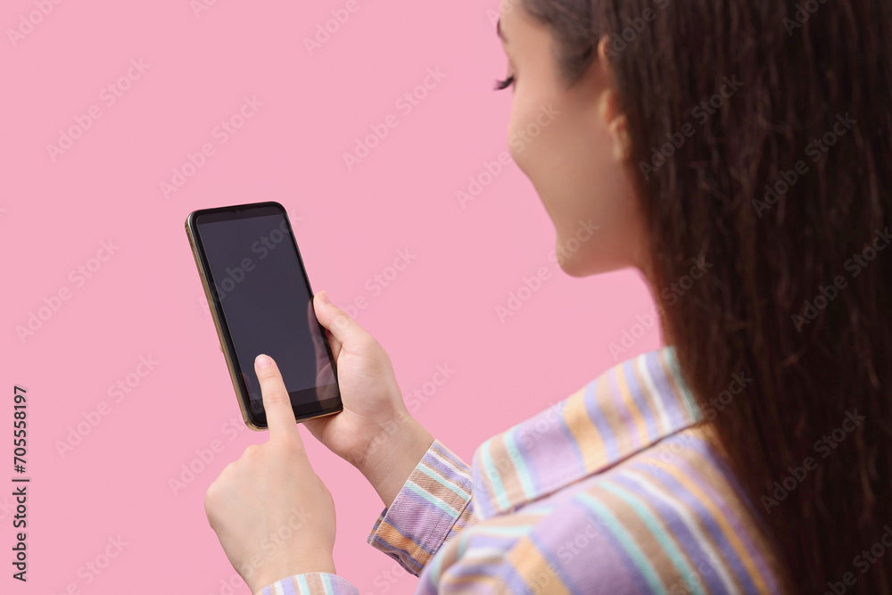 Woman using smartphone on pink background, closeup. Mockup for design