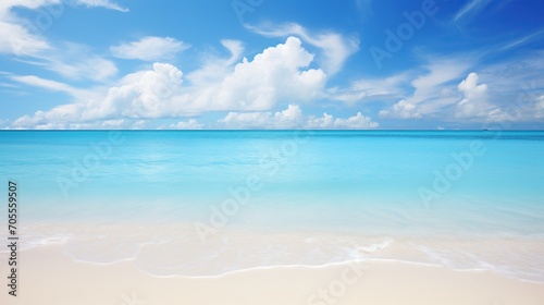 Serene beach landscape with vivid blue ocean under a clear sky, ideal for peaceful background. 