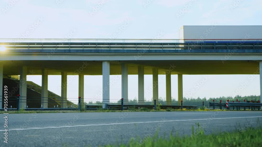 Lory long truck driving on highway overbridge. Cargo freight transit. Flyover on thruway road, overpass. Export import by logistic company concept. Transportation delivery by white trucker trailer