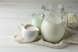 Lactose free dairy products on white wooden table, closeup