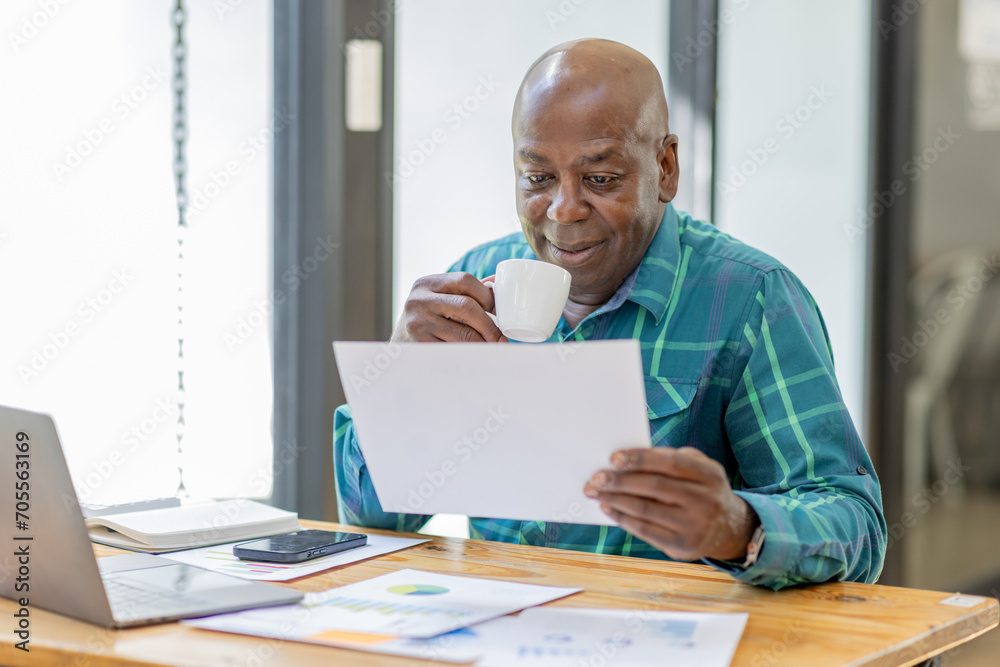 Business senior man 60 years old using laptop computer coffee cup in office. Happy middle aged man, entrepreneur, small business owner working online. Business senior man 60 years old using laptop computer coffee cup in office. Happy middle aged man, entrepreneur, small business owner working online.