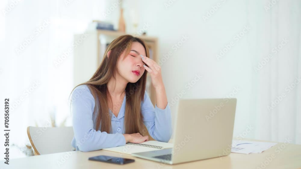 Office syndrome. Overworked tired young asian woman feeling headache, having eyesight problem after computer laptop work. Stressed young woman suffering from fatigue at home Office syndrome. Overworked tired young asian woman feeling headache, having eyesight problem after computer laptop work. Stressed young woman suffering from fatigue at home