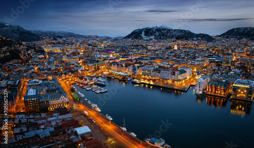 Panoramic aerial view of the illuminated cityscape of Bergen, Norway, during a cold winter night