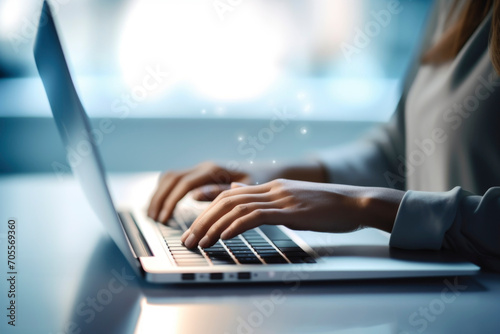 Businesswoman sitting operating laptop, typing office work