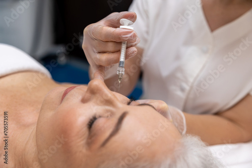 Female patient having anti age treatment at cosmetologist