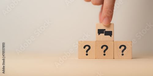 Q and A concept. Q and A symbols on wooden cube blocks on a grey background. Illustration for frequently asked questions concepts in websites, social networks, business issues. Recommendation concept. photo