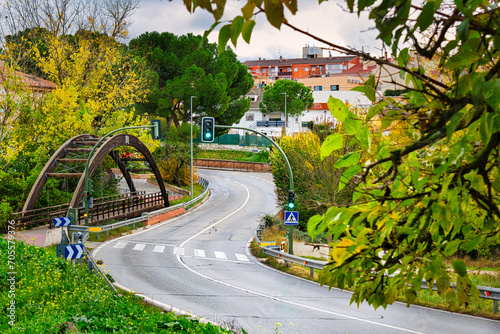Curves on the M-413 road, next to a wooden pedestrian bridge, at the entrance to the town of Arroyomolinos, Madrid (Spain).