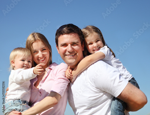 Happy young family outdoors