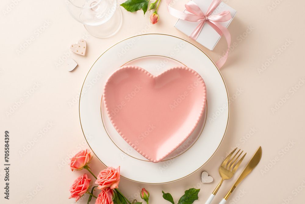 Intimate dinner affair with top view heart-shaped plates, cutlery, and wine glass. Beautiful roses, a gift box, and themed decor accentuate the pastel beige scene, inviting love and romance Intimate dinner affair with top view heart-shaped plates, cutlery, and wine glass. Beautiful roses, a gift box, and themed decor accentuate the pastel beige scene, inviting love and romance
