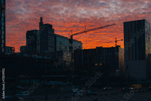 Panoramic view of the city of Dnipro during sunset or sunrise. Amazing sunset at Dnipro river with a view of the historical center. Winter sunset. Evening city.