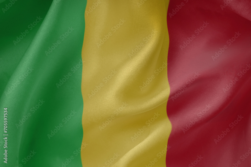 Mali waving flag close up fabric texture background
