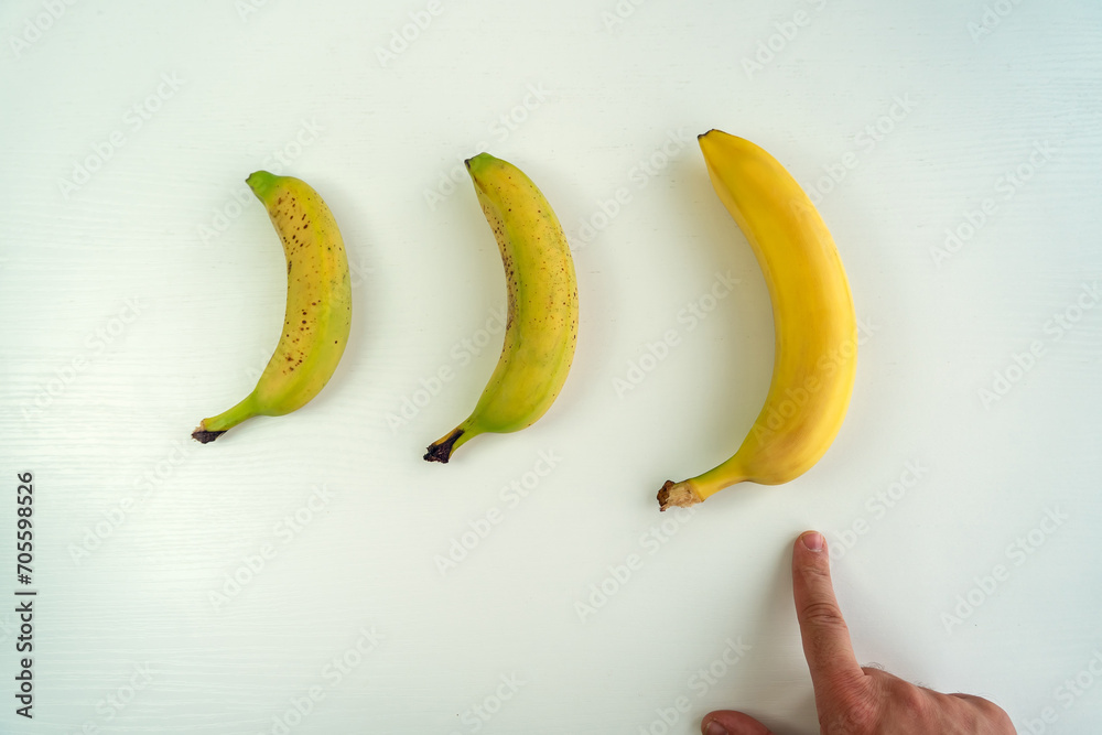 Different size and shape of Banana compare, penis Size compare concept. Men's intimate plastic surgery - obrazy, fototapety, plakaty 