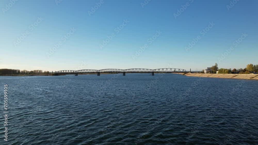 Drone flying close to water towards a bridge Drone flying close to water towards a bridge