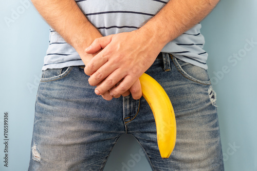 banana out of mens jeans like mens penis. potency concept photo