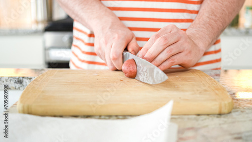 Young Man Enthusiastically Preparing Dinner in Modern Kitchen