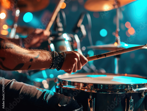 Close-up of a drummer playing with sticks in motion, vibrant live music scene.