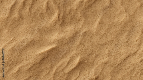 Beige sand seamless pattern. Repeated background of sandy texture.