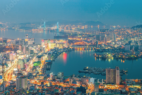 The night view of the city. The night view of Busan Port with colorful building  road  and bridge from the observation deck of Cheonmasan Mountain in Busan  Korea.