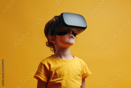 A young girl wearing a virtual reality headset. Perfect for illustrating the concept of technology and virtual reality experiences © Fotograf