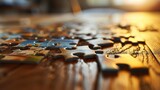 Sunlit jigsaw puzzle pieces on a wooden table